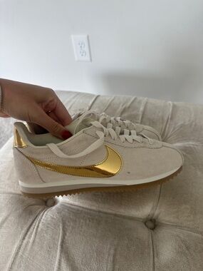 Nike Women's Cortez Suede Sneakers in Light Beige with Gold Swoosh